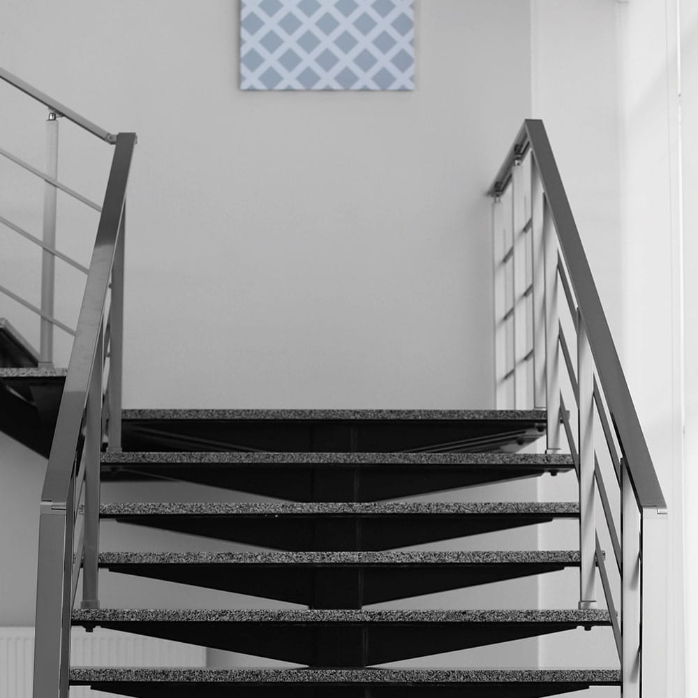 granite stairs within a home, emphasizing the structure's interior elegance and design